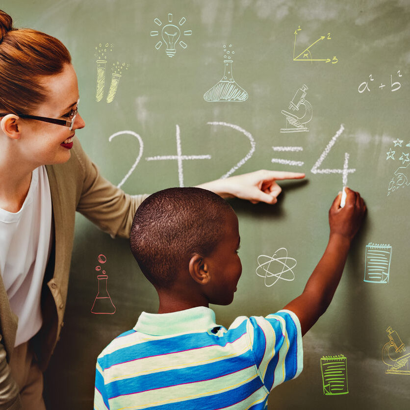 Women-Tutoring-maths-in-the-blackboard